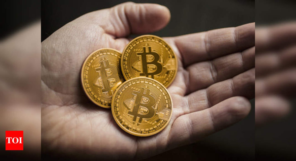 Bitcoin price: Bitcoin hits record high; passes $60,000 for first time | International Business News - Times of India