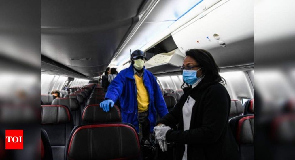 Flyers must wear masks properly, may face legal action for flouting norms: DGCA - Times of India