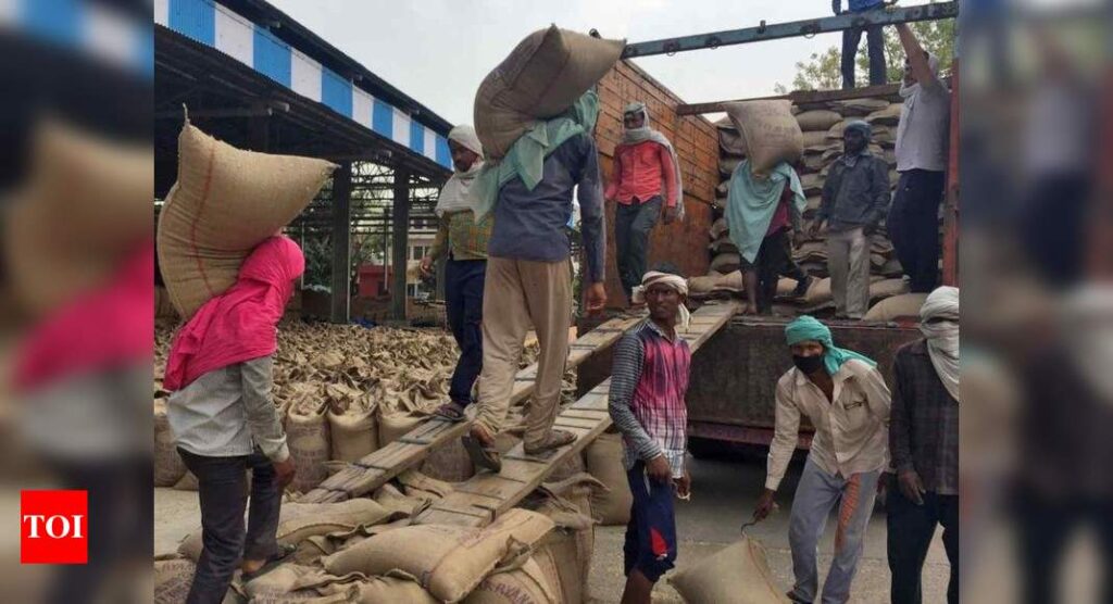 Hunger crisis forces even middle-class Indians to line up for rations - Times of India