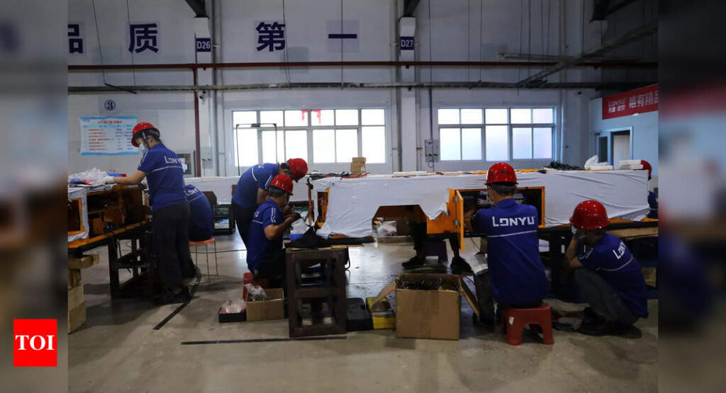 China manufacturing unexpectedly shrinks, first time since Covid pandemic - Times of India