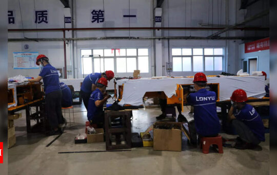 China manufacturing unexpectedly shrinks, first time since Covid pandemic - Times of India