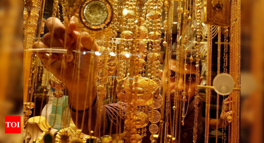 Gold prices in check as central banks rev up policy tightening - Times of India