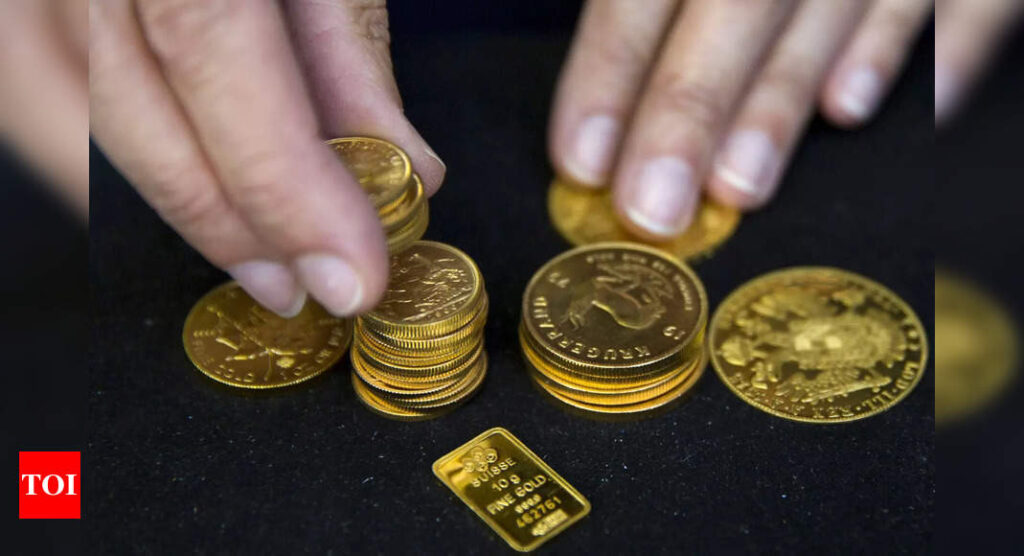 Gold drops to near one-year low as rate-hike fears loom - Times of India