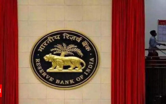RBI takes steps to attract dollar in bid to check rupee's slide - Times of India