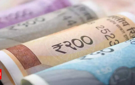 Rupee at over 1-week high on broad dollar losses; bond yields slip - Times of India