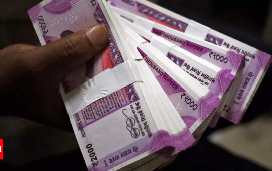 Rupee settles at record low of 79.98 against US dollar; briefly touches 80/$ mark - Times of India