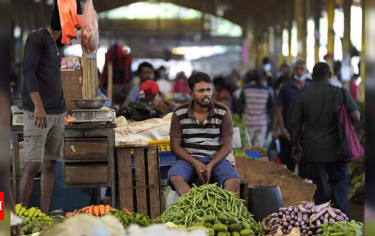 Sri Lanka hikes rates in face of record inflation, despite economic contraction - Times of India