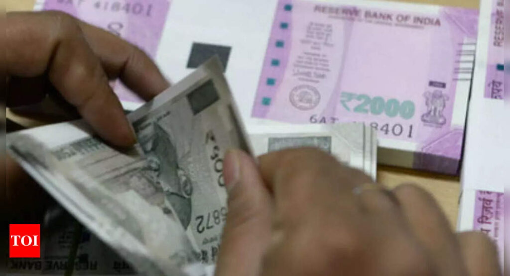 Rupee inches towards record low on yuan weakness - Times of India