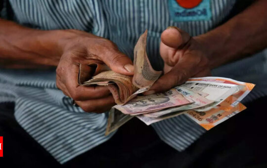 Rupee weakens after four days of gains on record trade deficit - Times of India